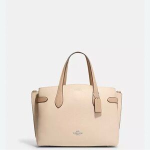 Coach Pebble Tan Leather Tote with Sophisticated Design
Coach Hanna Carryall.
